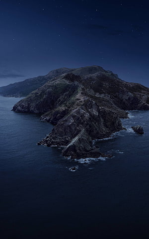 Misty Coastal Mountain Ridge Under a Starry Night Sky HD phone wallpaper