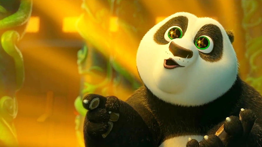 Po from Kung Fu Panda 3 with glowing green eyes in a warm golden setting HD wallpaper