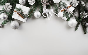 Elegant White Christmas Border With Pine Branches, Glittery Reindeer, and Gift Boxes HD wallpaper