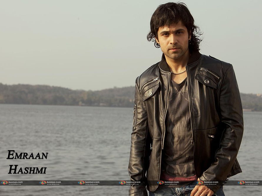 Emraan Hashmi in a black leather jacket standing by a calm lake with distant hills HD wallpaper