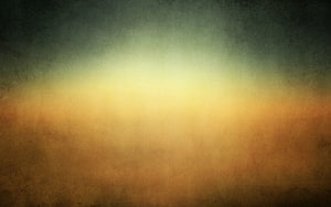 Warm Golden Gradient with Dark Textured Edges and Soft Central Glow HD wallpaper