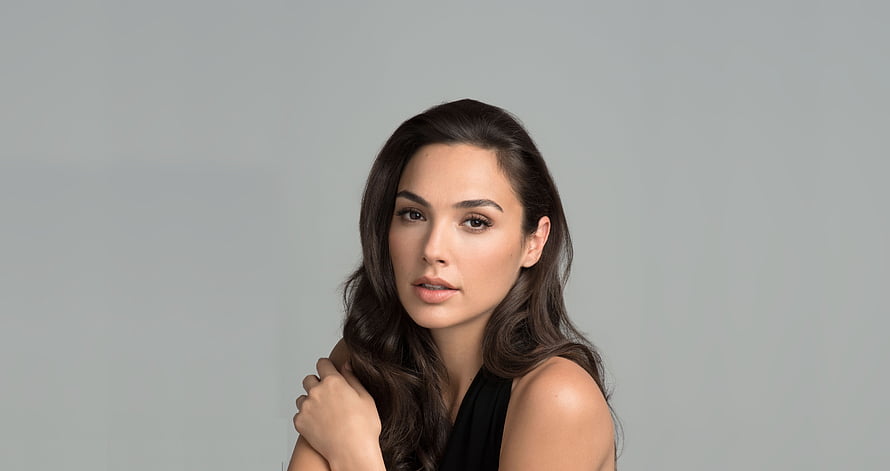 Gal Gadot Studio Portrait in Black Sleeveless Top Against Neutral Gray Background HD wallpaper