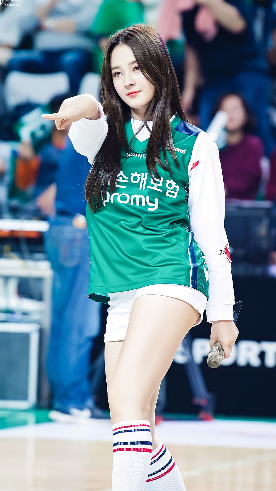 Nancy from Momoland performing in a green sports jersey at a Korean basketball event HD phone wallpaper
