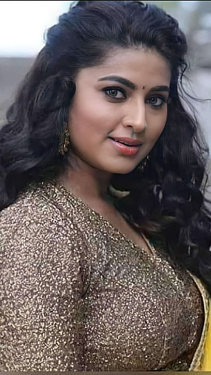 Sneha Portrait in Gold Sequined Blouse with Long Wavy Hair and Traditional Earrings HD phone wallpaper