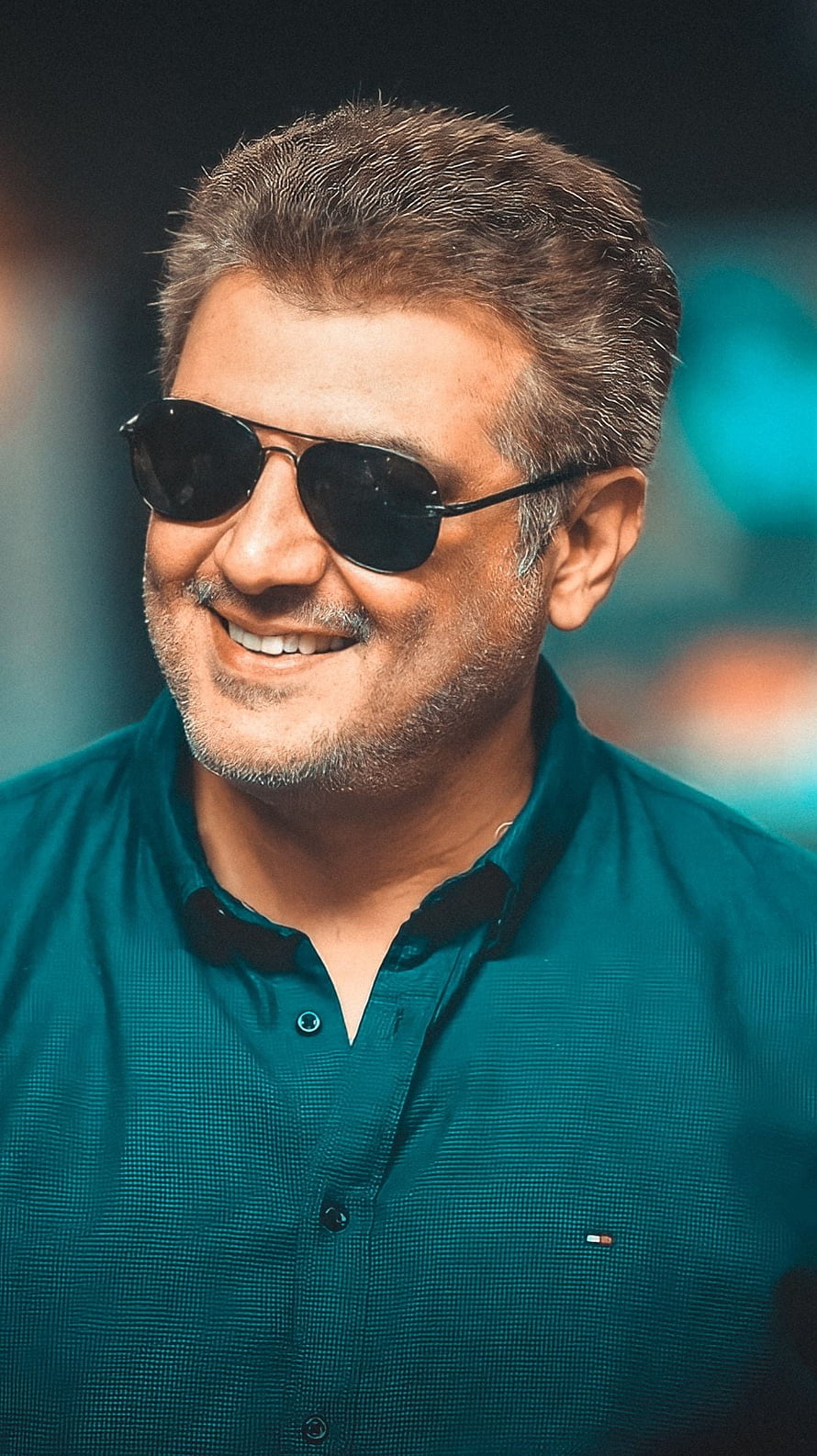 Ajith Kumar Wearing Aviator Sunglasses and a Teal Button-Down Shirt HD phone wallpaper