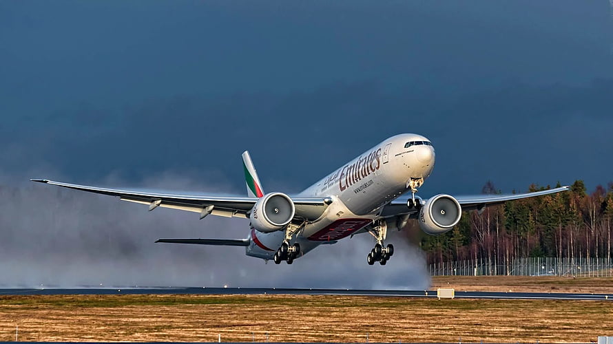Emirates Boeing 777 Passenger Jet Taking Off From Runway In Dramatic Stormy Sky HD wallpaper