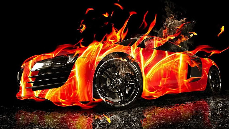 Flaming Sports Car Enveloped in Intense Fire on Dark Wet Surface HD wallpaper