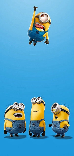Four Minions in Blue Overalls on a Solid Cyan Background HD phone wallpaper