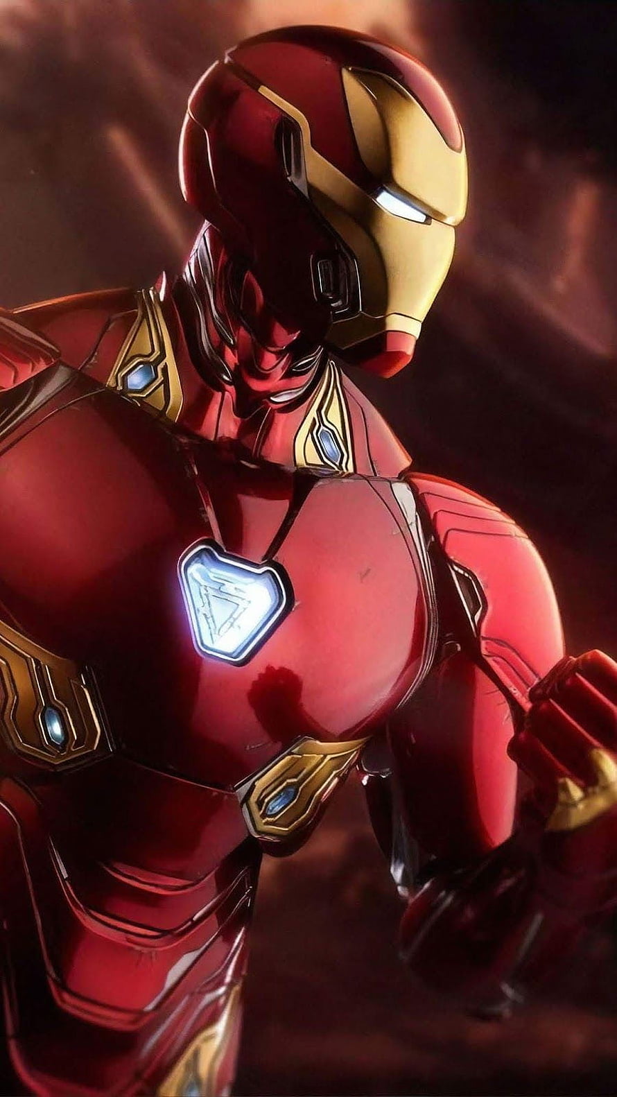 Iron Man Mark 85 Armor Close-Up with Glowing Arc Reactor and Gold Accents HD phone wallpaper