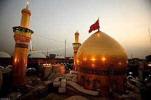 Golden Dome and Minarets of Karbala Shrine at Dusk HD wallpaper