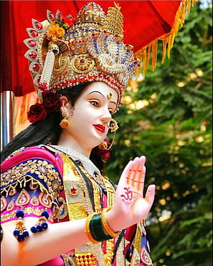 Ornate Goddess Durga Statue in Traditional Indian Attire with Elaborate Crown and Jewelry HD phone wallpaper