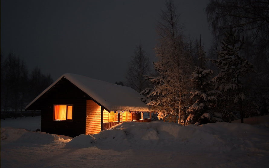 Cozy Log Cabin Glowing Under Snow at Night HD wallpaper