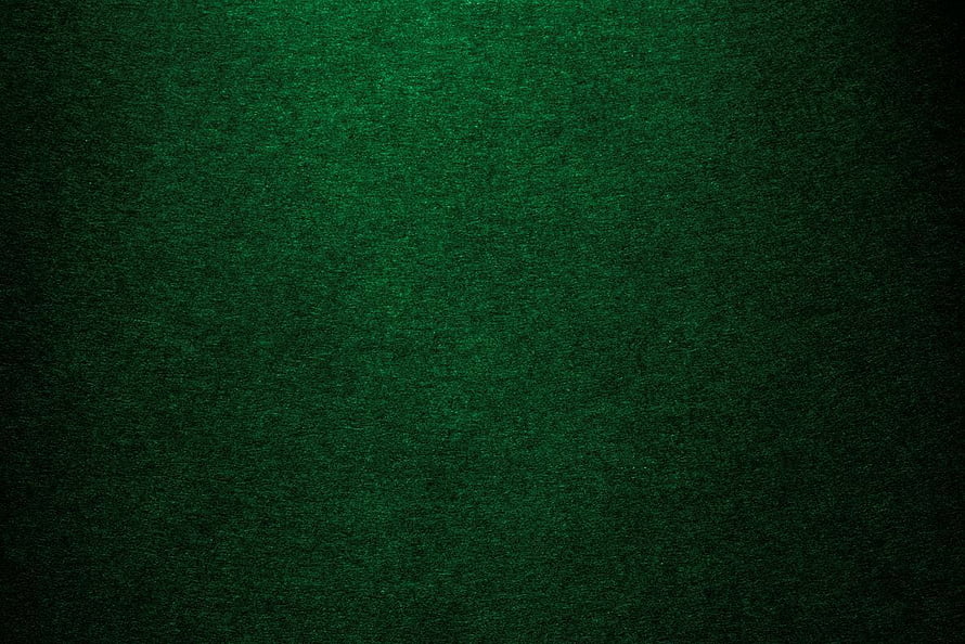 Deep Emerald Green Textured Surface with Subtle Vignette and Grainy Fabric Detail HD wallpaper