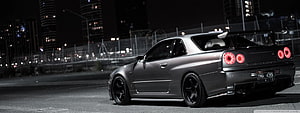 Modified Nissan Skyline GT-R R34 Night City Street Scene HD wallpaper