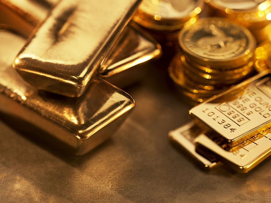 Stacked Gold Bars and Coins on a Dark Surface for Wealth and Prosperity HD wallpaper
