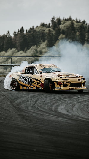 Gold Mazda RX-7 Drift Car Performing Burnout on Asphalt Track HD phone wallpaper