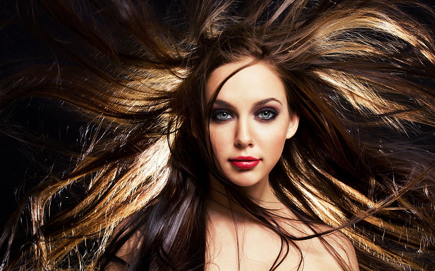Dramatic Portrait of a Woman with Flowing Hair and Bold Red Lips HD wallpaper