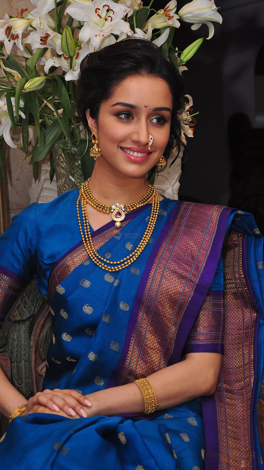 Shraddha Kapoor in a blue silk saree with gold jewelry and white lilies HD phone wallpaper