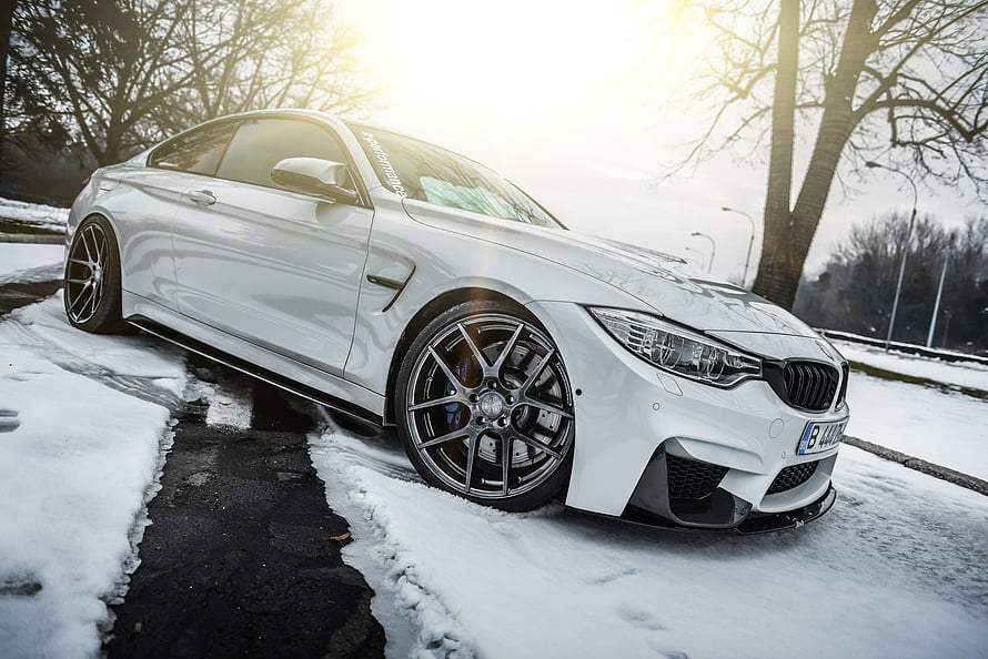 White BMW M4 Coupe Parked on Snowy Road with Custom Forged Wheels HD wallpaper