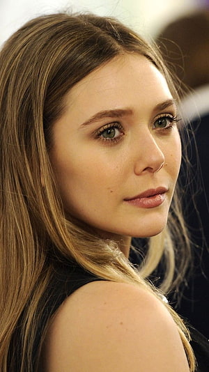 Elizabeth Olsen Close-Up Portrait with Long Blonde Hair and Soft Studio Lighting HD phone wallpaper