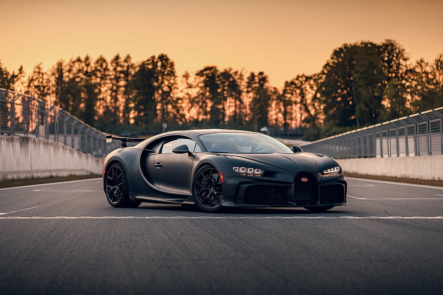 Matte Black Bugatti Chiron Pur Sport on a Race Track at Sunset HD wallpaper