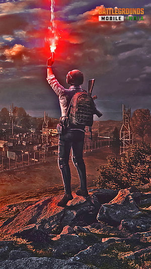 Battlegrounds Mobile India Soldier Firing Red Flare on Rocky Hilltop at Dusk HD phone wallpaper