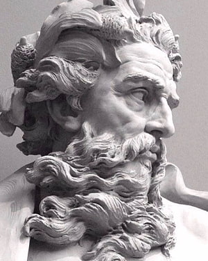 Close-up of a classical Zeus statue with detailed beard and laurel wreath HD phone wallpaper