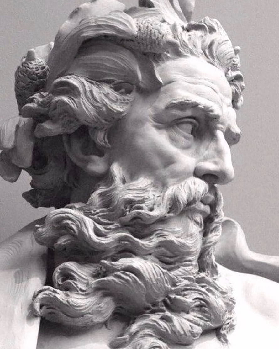 Close-up of a classical Zeus statue with detailed beard and laurel wreath HD phone wallpaper