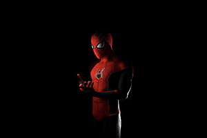 Spider-Man in Advanced Red Suit Against Dark Background HD wallpaper