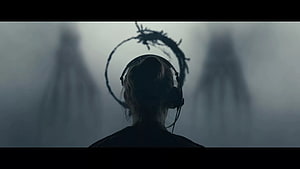 Arrival Movie Scene Featuring Silhouetted Figure with Headset and Abstract Shadow HD wallpaper