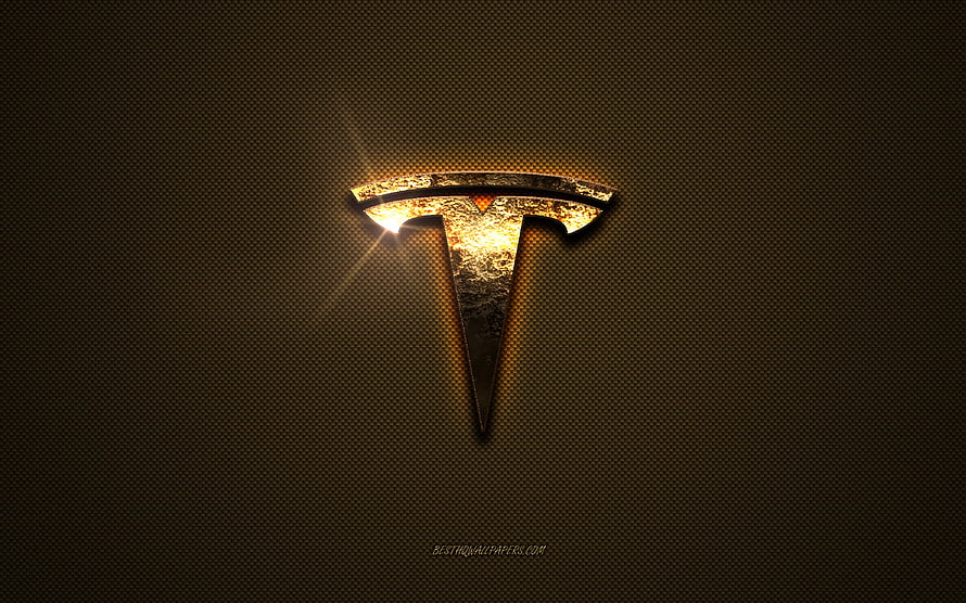 Glowing Tesla Emblem on Textured Brown Metal Surface with Dramatic Lighting HD wallpaper