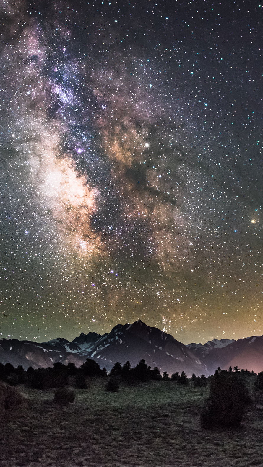 Milky Way Galaxy Rising Over Snow-Capped Mountain Peaks at Night HD phone wallpaper