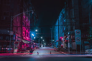 Neon-Lit Urban Street at Night with Cinematic Pink and Blue Lighting HD wallpaper