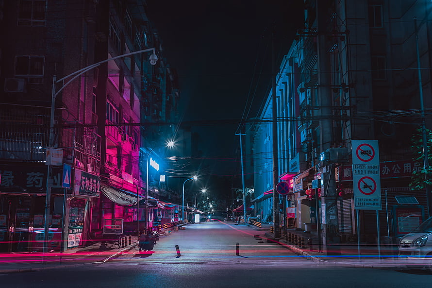 Neon-Lit Urban Street at Night with Cinematic Pink and Blue Lighting HD wallpaper
