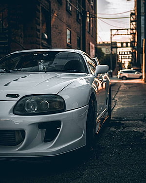 White Toyota Supra MK4 A80 JDM Coupe Parked on Urban Street at Dusk HD phone wallpaper