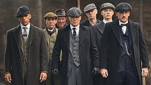 Peaky Blinders Cast in Period Suits and Flat Caps Walking Through Industrial Setting HD wallpaper