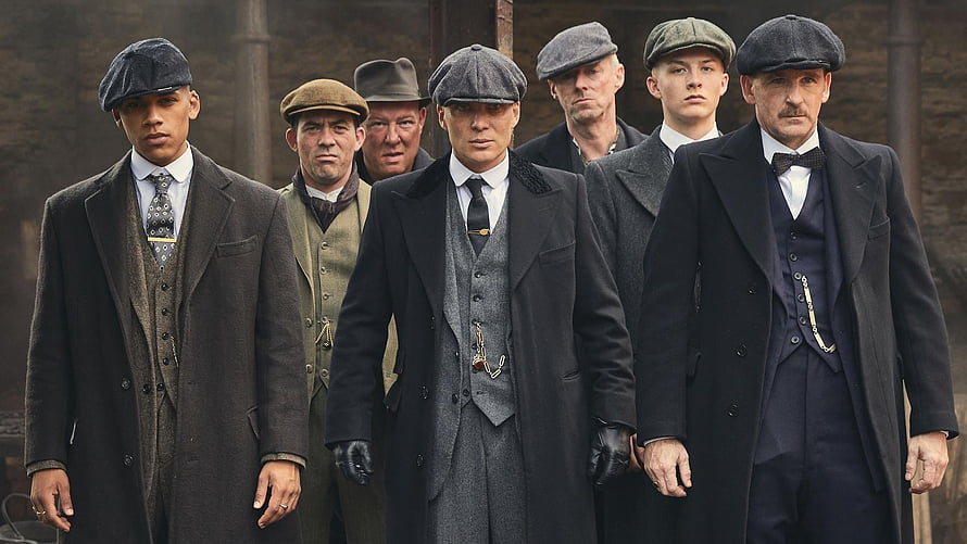 Peaky Blinders Cast in Period Suits and Flat Caps Walking Through Industrial Setting HD wallpaper