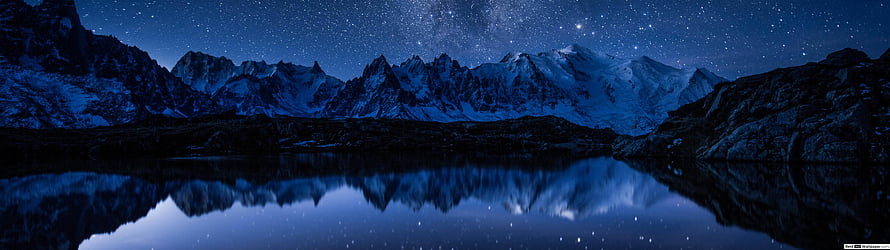 Starry Night Sky Over Snow-Capped Mountains Reflected in a Calm Alpine Lake HD wallpaper