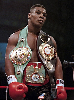 Mike Tyson Wearing Multiple Championship Belts in the Boxing Ring HD phone wallpaper
