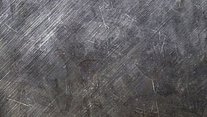 Scratched Dark Metal Surface Texture with Diagonal White Steel Marks HD wallpaper