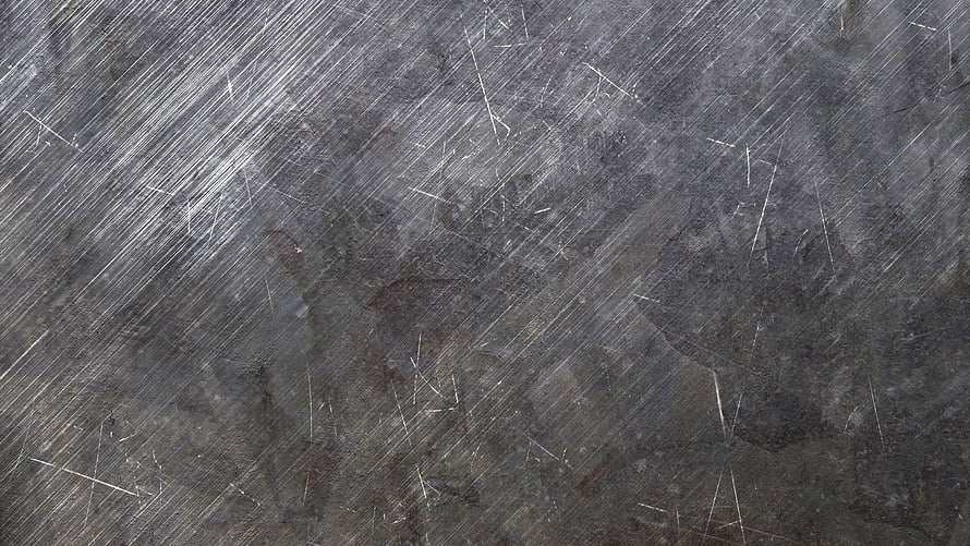 Scratched Dark Metal Surface Texture with Diagonal White Steel Marks HD wallpaper