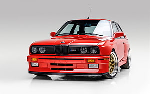 Red BMW M3 E30 Front View with Gold Wheels on White Studio Background HD wallpaper
