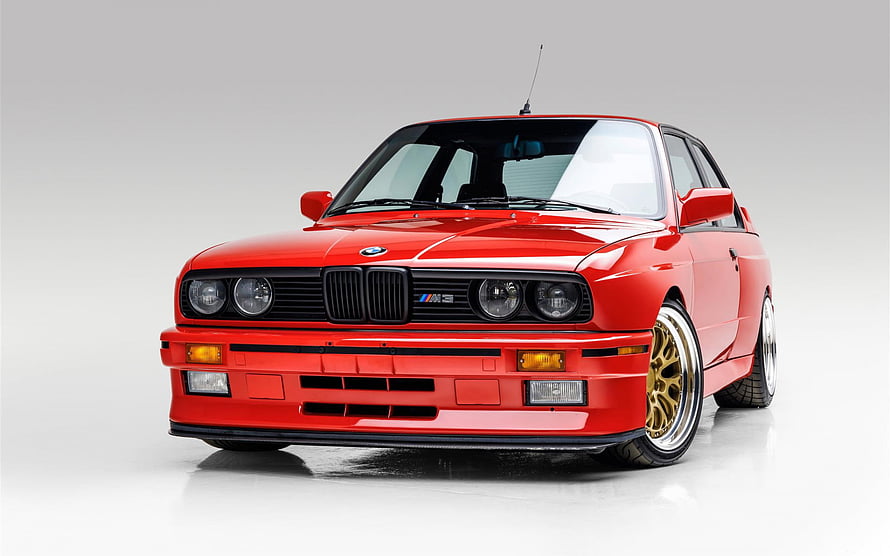 Red BMW M3 E30 Front View with Gold Wheels on White Studio Background HD wallpaper