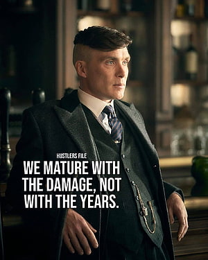 Tommy Shelby in a dark three-piece suit with a pocket watch chain in a dimly lit bar HD phone wallpaper