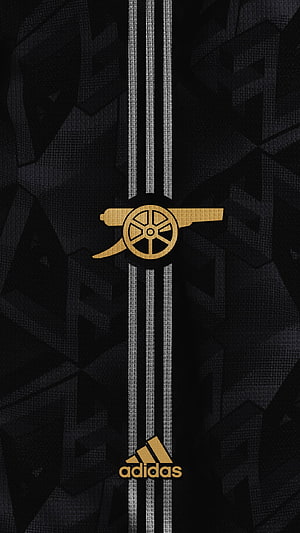Arsenal FC Black and Gold Adidas Kit Design with Cannon Emblem and Geometric Pattern HD phone wallpaper