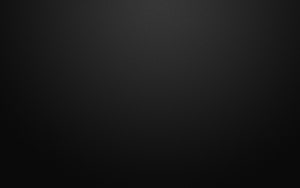 Dark Textured Black Surface with Subtle Diagonal Pattern and Soft Vignette HD wallpaper