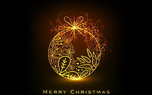 Glowing Golden Christmas Ornament with Floral Patterns and Sparkling Light Effects on Black Background HD wallpaper