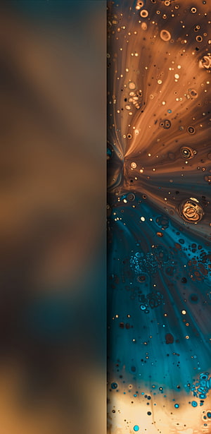 Abstract Fluid Art with Swirling Bubbles in Warm Amber and Cool Teal Tones HD phone wallpaper