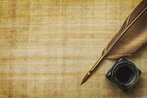 Vintage Quill Pen and Inkwell on Aged Parchment Background HD wallpaper