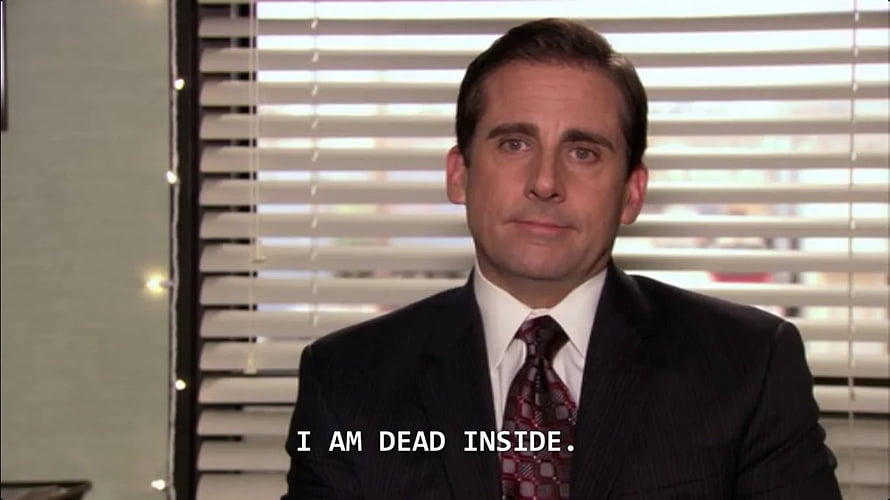 Michael Scott in a dark suit with a deadpan expression in front of office blinds HD wallpaper
